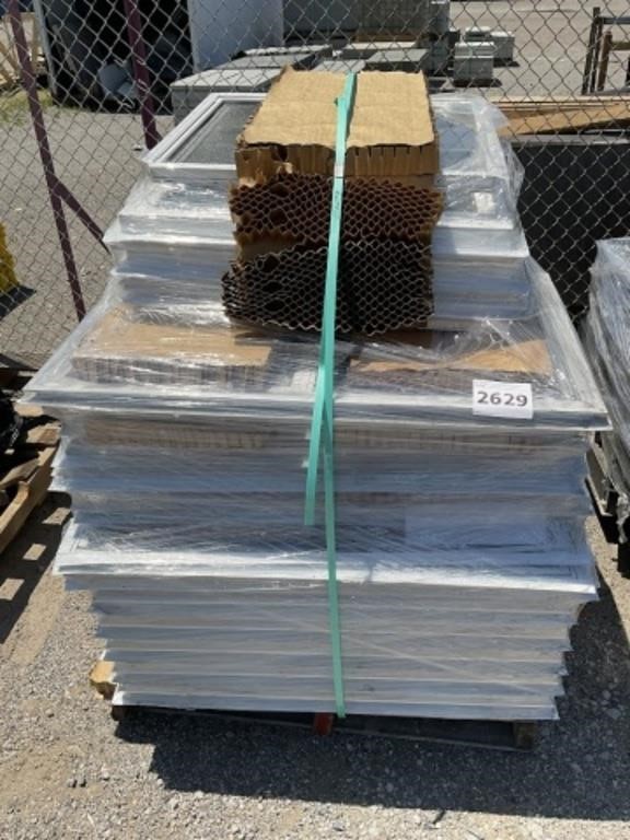 Pallet Of mixed Size Storm Windows.