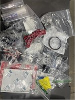 Large box of drone repair parts and hardware