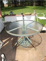 patio table with umbrella stand .