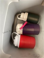 A tote and box with water jugs, small coolers and