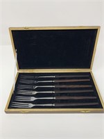 Vintage serving forks in wood case