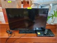 MAGNAVOX 32” FLAT SCREEN TV AND DVD PLAYER