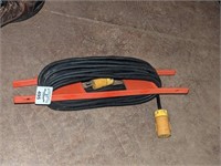 Black extension cord on reel