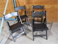 wooden folding chairs .