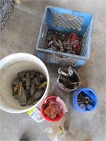 bucket and crate of  valves, fittings