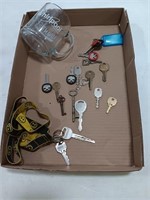 Assortment of keys, Whirlpool glass mug.