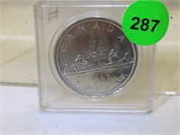 1965 Silver Canadian Dollar coin in plastic