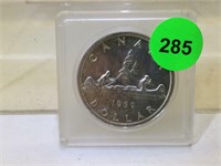 1959 Silver Canadian Dollar coin in plastic
