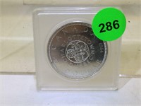 1964 Silver Canadian Dollar coin in plastic