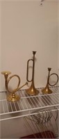 Three vintage polished brass horn candelabras