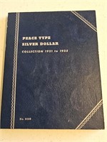 16 SILVER PEACE DOLLARS IN BOOK