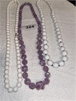 2 white, 1 purple necklace