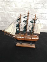3 Mast replica wooden ship model on a stand.