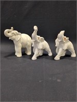 White elephants, one has broken trunk, one has