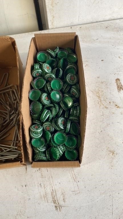 Box of beer caps and staples and screws