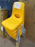 6 child's yellow stack chairs