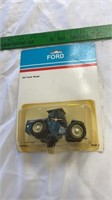 Ford 1/64 scale model tractor.