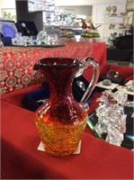 Orange and red pitcher