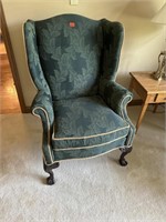 Pair of green fabric chairs with stool