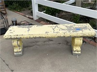 yellow painted concrete bench