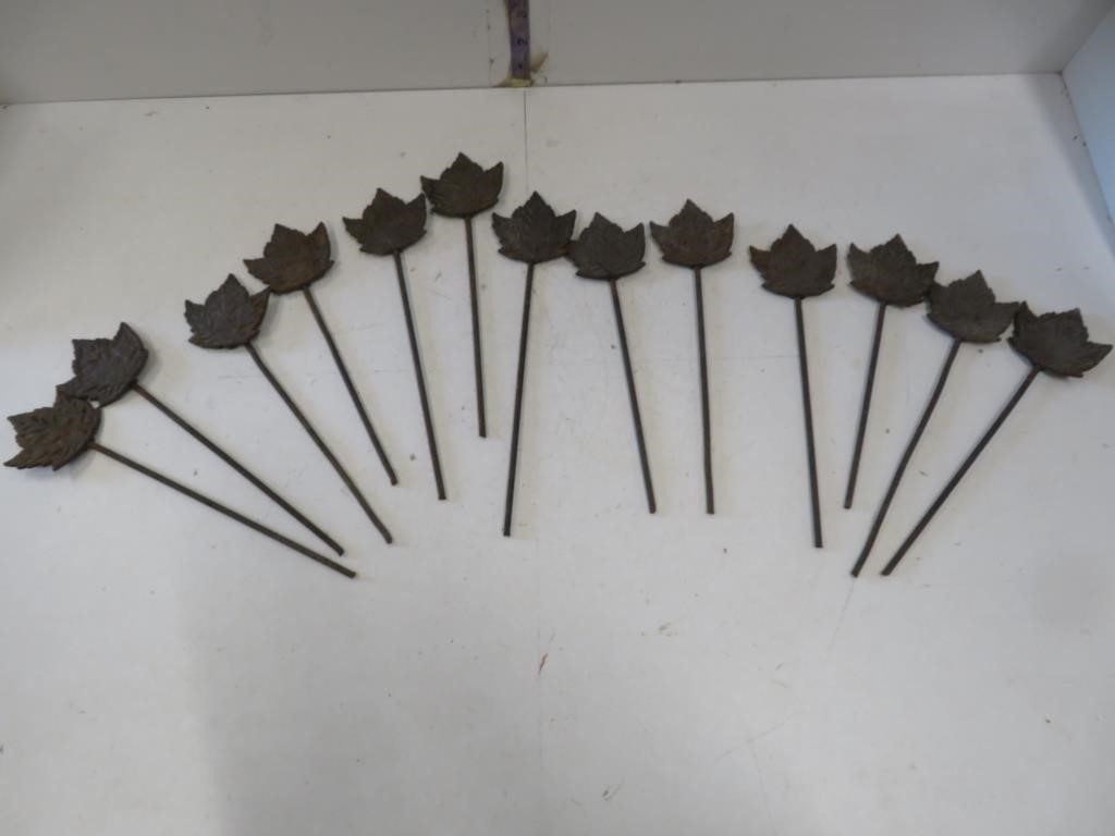 13 cast iron Maple leaf fence pegs, 10" long
