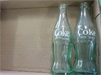2 Coca-Cola bottles