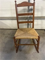 Wooden rocker with woven seat