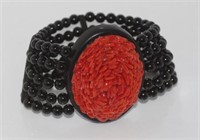 Large ebony, onyx and coral stretch bracelet