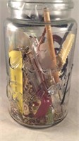 Kerr mason jar filled with jewelry and treasures