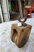 Wood pulley and case with metal hook