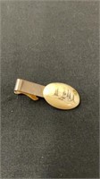 Tie clasp with gold nugget carved