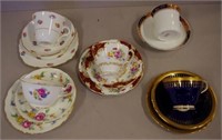 Four various English trios & a cup and saucer
