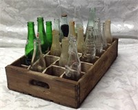 Vintage wooden crate with vintage bottles