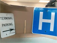 Metal terminal parking sign and blue hospital