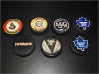 7 Vintage Hockey Pucks