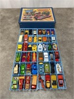 Vintage Matchbox and other toy cars with carrying