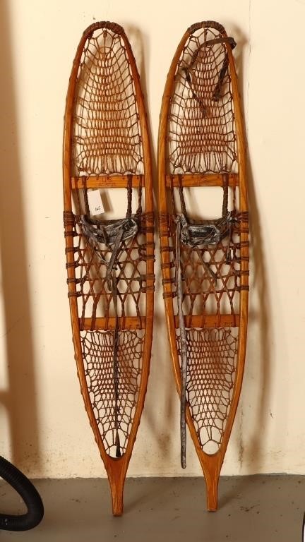 Pair of antique snow shoes by C.A. Lund Co.