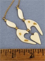 2 1/2" ivory pendent, contemporary, with 4 oat siz