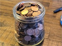 Jar of assorted pennies, net weight approx. 1698
