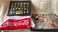 Coca-Cola pins, sweater, and memorabilia