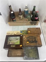 Vintage bottles, coasters and boxes