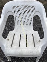 Two plastic lawn chairs