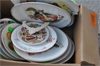 box of Norman Rockwell and Avon plates