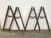 Two pairs of metal saw horse bracket stands