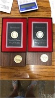 2 Eisenhower 1974 dollar coins in cases each