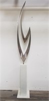 Signed stainless steel sculpture on pedestal