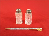 Pair of sterling lidded salt and pepper shakers