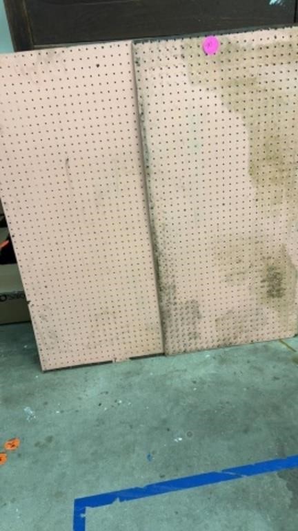 TWO PINK COLORED SHEETS OF PEGBOARD 
USED