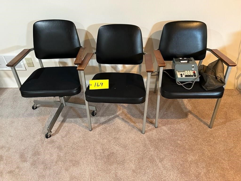 3 office chairs, one has roller wheels