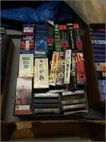Box of assorted VCR tapes, cassette tapes